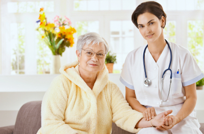 nurse and senior woman smiling